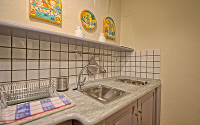 Camino: Fliese, Eigentum, Zimmer, Countertop, Die Architektur, Möbel, Interior Design, Grundeigentum, Badezimmer, Küche
