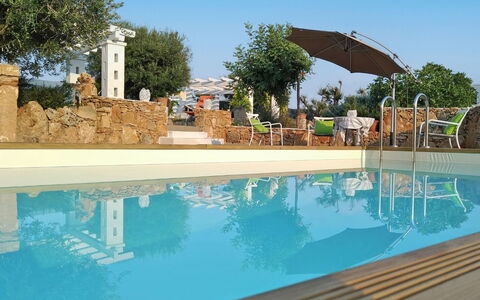 Villa Giunone: Schwimmbad, Eigentum, Wasser, Grundeigentum, Regenschirm, Azurblau, Aqua, Reflexion, Resort, Schatten