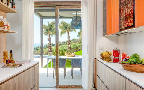 Villa Smeraldo - Sea Front | By Rocco Forte Villas: Eigentum, Pflanze, Countertop, Cabinetry, Azurblau, Gebäude, Tabelle, Beleuchtung, Orange, Interior Design