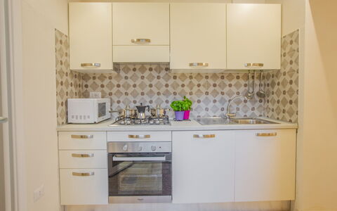 Casa Ettore: Küchengerät, Küche, Major Appliance, Countertop, Cabinetry, Holz, Flooring, Interior Design, Fussboden, Herd