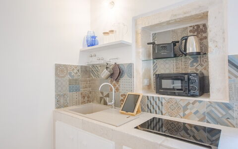 Casa Bolero: Flooring, Interior Design, Fussboden, Fliese, Countertop, Küche, Mosaik, Keramik, Light Fixture, Major Appliance