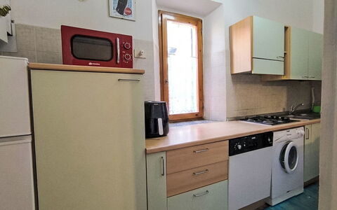 Casa Lelà: Küchengerät, Major Appliance, Küche, Holz, Flooring, Countertop, Cabinetry, Fussboden, Haushaltsgerät, Interior Design